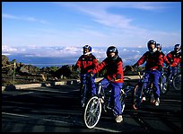 Getting ready to ride bicycles down from the top of the Crater to sea level. Haleakala National Park, Hawaii, USA.