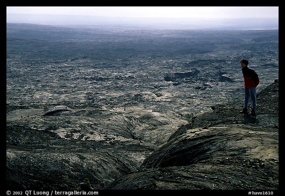 Hiker on top of Mauna Ulu crater. Hawaii Volcanoes National Park (color)