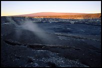 Halemaumau crater overlook and Mauna Loa, sunrise. Hawaii Volcanoes National Park, Hawaii, USA.