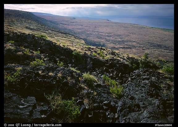 Black lava and  coastal plain from Hilana Pali. Hawaii Volcanoes National Park (color)