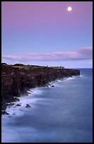 Holei Pali volcanic cliffs and moon at dusk. Hawaii Volcanoes National Park, Hawaii, USA.