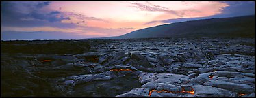 Landscape with red lava flow at sunset. Hawaii Volcanoes National Park (Panoramic color)