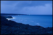 Coast covered with hardened lava and approaching storm. Hawaii Volcanoes National Park ( color)