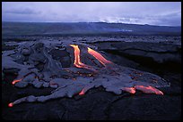 Molten lava flow at dawn on coastal plain. Hawaii Volcanoes National Park, Hawaii, USA. (color)