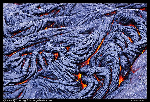 Braids of pahoehoe lava with red hot lava showing through cracks. Hawaii Volcanoes National Park, Hawaii, USA.