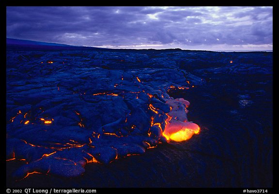 Red lava glows at dawn. Hawaii Volcanoes National Park, Hawaii, USA.