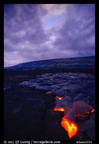 Molten Lava glows at dawn. Hawaii Volcanoes National Park, Hawaii, USA.