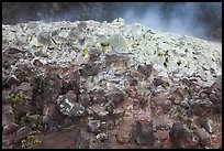 Mound of rocks covered with sulphur from vent. Hawaii Volcanoes National Park, Hawaii, USA.