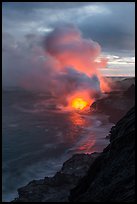 Coastline with steam illuminated by molten lava. Hawaii Volcanoes National Park, Hawaii, USA. (color)