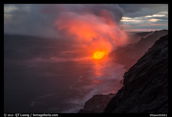 Coastline with steam lit by hot lava. Hawaii Volcanoes National Park, Hawaii, USA.