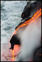Ribbons of lava flow into the Pacific Ocean. Hawaii Volcanoes National Park, Hawaii, USA. (color)