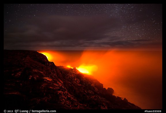 Lava makes contact with ocean on a stary night. Hawaii Volcanoes National Park, Hawaii, USA.