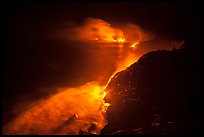 Streams of lava flow into Pacific Ocean. Hawaii Volcanoes National Park, Hawaii, USA.