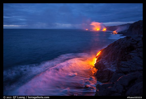 Lava reaching ocean at dawn. Hawaii Volcanoes National Park, Hawaii, USA.