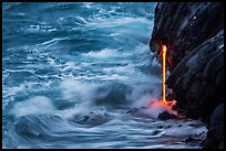 Waves and lava spigot. Hawaii Volcanoes National Park, Hawaii, USA. (color)