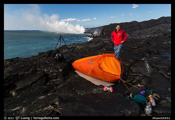 Photographer camping near lava ocean entry. Hawaii Volcanoes National Park, Hawaii, USA.