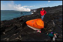 Photographer camping near lava ocean entry. Hawaii Volcanoes National Park ( color)