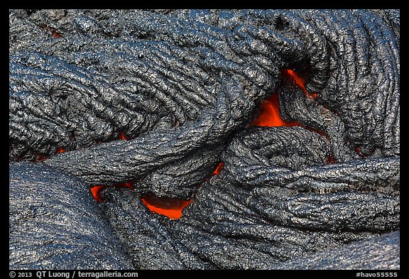 Silvery new lava with glow underneath. Hawaii Volcanoes National Park, Hawaii, USA.