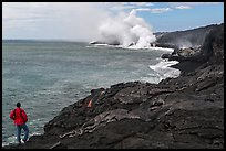 Park visitor looking, lava ocean entry plume. Hawaii Volcanoes National Park, Hawaii, USA.