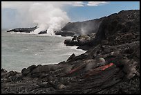 Molten lava flow and ocean plume. Hawaii Volcanoes National Park, Hawaii, USA. (color)