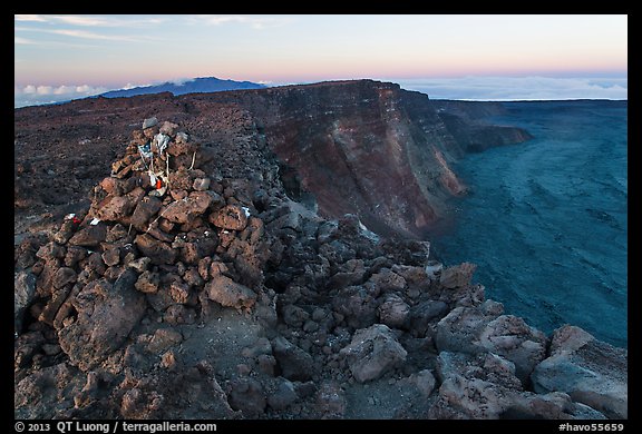 Summit cairn and crater at dusk. Hawaii Volcanoes National Park, Hawaii, USA.