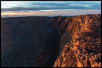 Cliffs bordering Mauna Loa summit caldera from rim at sunrise. Hawaii Volcanoes National Park, Hawaii, USA. (color)