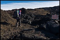 Backpacker entering park through Observatory Trail. Hawaii Volcanoes National Park, Hawaii, USA. (color)