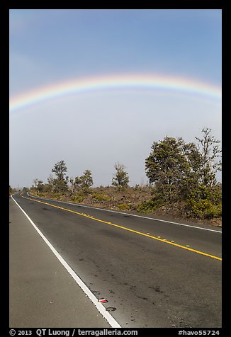 Rainbow above highway. Hawaii Volcanoes National Park, Hawaii, USA.