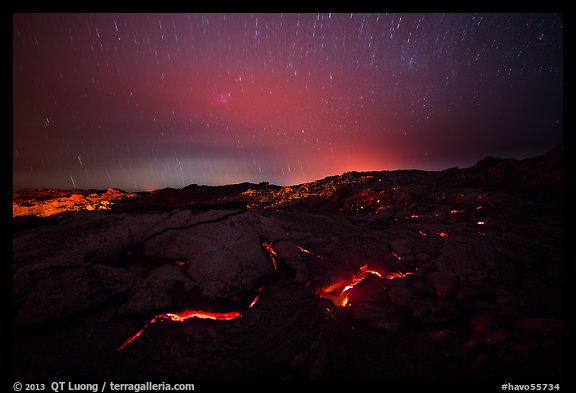Molten lava flow with star trails. Hawaii Volcanoes National Park, Hawaii, USA.