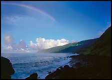 Rainbow and Mataalaosagamai sea cliffs in the distance, Tau Island. National Park of American Samoa (color)