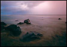 Rocks in water and approaching storm, Siu Point, Tau Island. National Park of American Samoa (color)