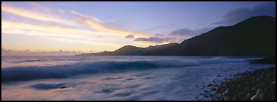 Wave and coastal hills at dawn, Tutuila Island. National Park of American Samoa (Panoramic color)