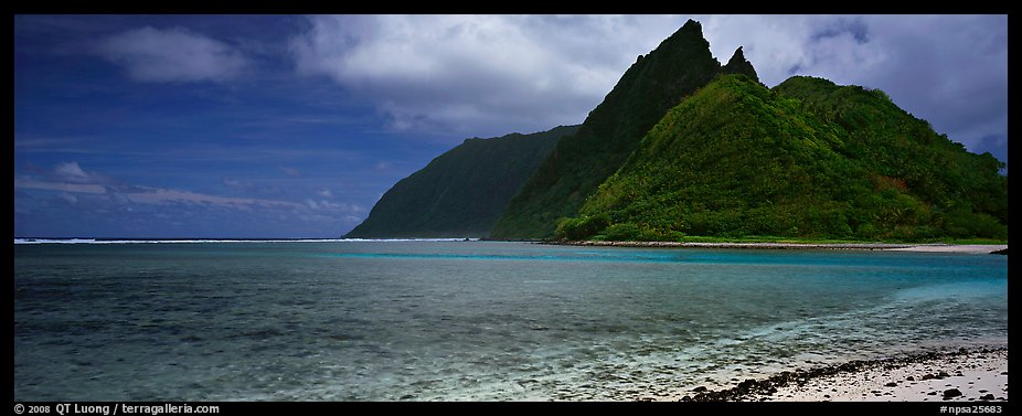 Tropical landscape with blue waters, pointed peaks, and clouds, Ofu Island. National Park of American Samoa