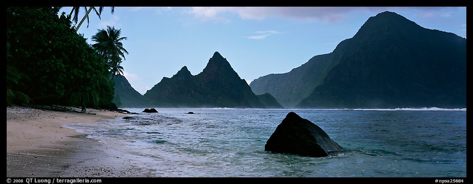 Tropical peaks raising abruptly above beach, Ofu Island. National Park of American Samoa