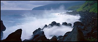 Shoreline with black rock pounded by strong surf, Tau Island. National Park of American Samoa (Panoramic color)