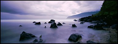 Coast with boulders and storm clouds, Tau Island. National Park of American Samoa (Panoramic color)