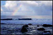 Rainbow and boulders, Siu Point, Tau Island. National Park of American Samoa