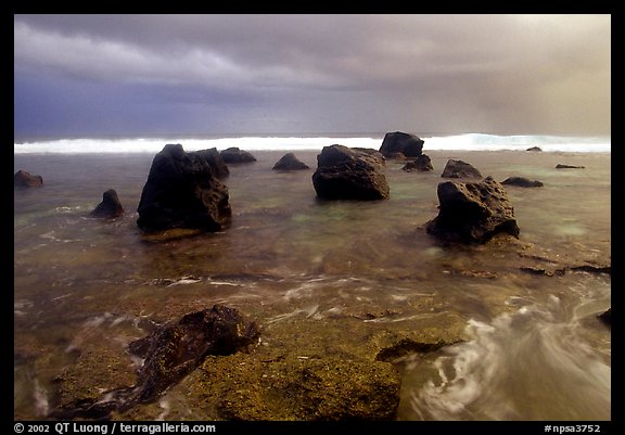 Boulders and approaching tropical storm, Siu Point, Tau Island. National Park of American Samoa (color)