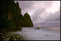 Peeble beach and Pola Island, stormy sunrise, Tutuila Island. National Park of American Samoa