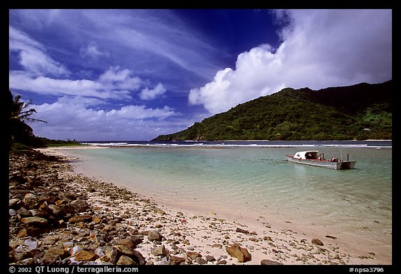 Fishing boat in Vatia Bay, mid-day, Tutuila Island. National Park of American Samoa