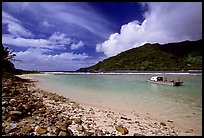 Fishing boat in Vatia Bay, mid-day, Tutuila Island. National Park of American Samoa