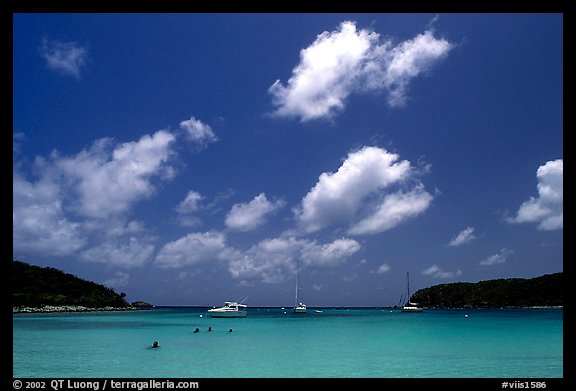 Saltpond bay beach with swimmers and boats. Virgin Islands National Park, US Virgin Islands.