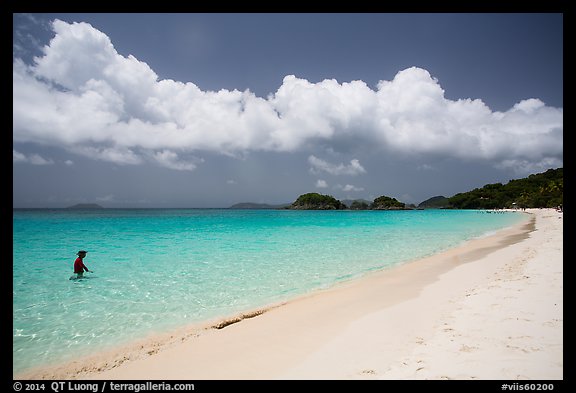 Visitor looking, Trunk Bay beach. Virgin Islands National Park, US Virgin Islands.