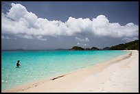 Visitor looking, Trunk Bay beach. Virgin Islands National Park, US Virgin Islands.