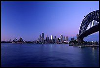 Harbour bridge, city skyline and opera house, dawn. Sydney, New South Wales, Australia (color)