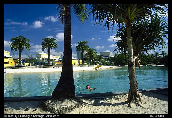 Artificial beach, complete with sand and palm trees. Brisbane, Queensland, Australia (color)