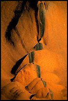 Rock sculptured by flash flood flows on Ayers Rock. Uluru-Kata Tjuta National Park, Northern Territories, Australia