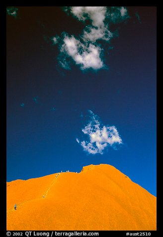 Hikers ascend Ayers Rock. Uluru-Kata Tjuta National Park, Northern Territories, Australia