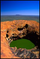 Green pool on Ayers Rock, Olgas in a distance. Uluru-Kata Tjuta National Park, Northern Territories, Australia