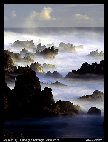 Rocks and waves at sunrise, Keanae Peninsula. Maui, Hawaii, USA